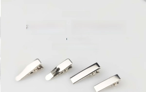 Macro view of 2cm silver metal mini alligator hair clips with smooth polished finish