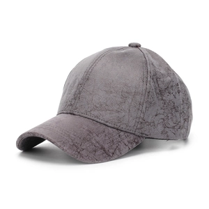 Detail shot of grey baseball cap featuring vintage cracked texture and six-panel design