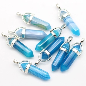 Detailed view of nine hexagonal blue agate crystal pendants with silver metal clasps