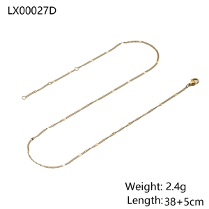 Detail view of a 38cm gold snake chain necklace with lobster clasp and extension