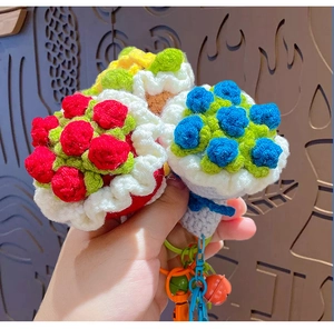 Detailed view of handmade crochet rose bouquets with colorful bells and metal rings