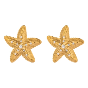 Close-up of elegant gold starfish earrings featuring sparkling inlaid crystal details