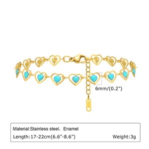 Detail of gold heart link bracelet with turquoise enamel inlay and extension chain