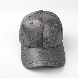 Close-up of the silver glitter fabric texture and curved brim on the baseball cap