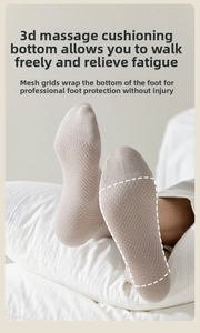 Detail of light beige socks featuring 3D grid texture for foot massage and cushioning