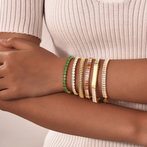 Luxurious gold stainless steel bracelets for women with green and white cubic zirconia stones