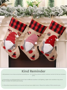 Three hanging Christmas stockings with buffalo plaid cuffs and gnome embroidery on a fireplace
