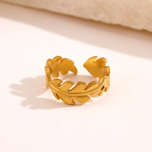 Adjustable matte gold leaf ring in stainless steel with detailed plant texture