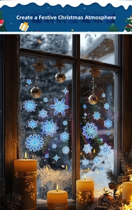 Blue snowflake window clings with stars and candles creating a cozy Christmas atmosphere
