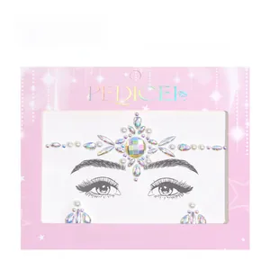 Close-up of AB iridescent face jewels and pearls in pink retail card packaging