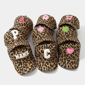 Vintage leopard print baseball caps with various embroidered patches for women