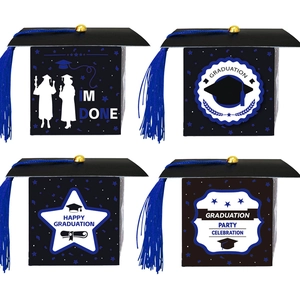 Detail view of graduation cap gift boxes featuring tassels and festive English typography