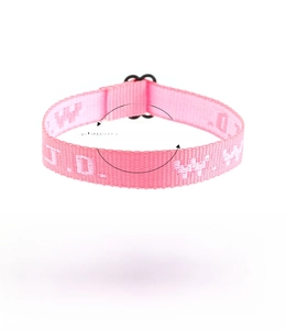 Detail of pink woven WWJD bracelet with adjustable strap and white embroidered lettering