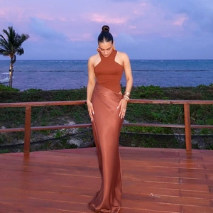 Elegant satin caramel maxi dress with a halter neck and slim fit for outdoor occasions