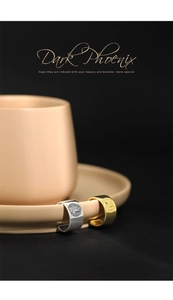 Macro detail of retro gold and silver Elizabeth coin rings on a luxury background