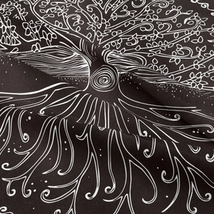 Close-up of bohemian tree of life tapestry showing fabric texture and white line art