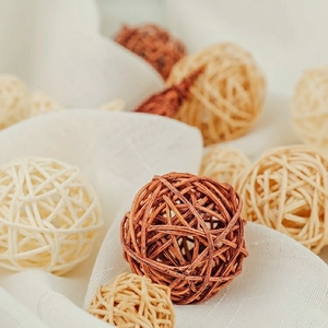 Natural woven rattan balls in brown and beige for Nordic style home decoration