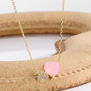 Elegant gold S925 silver necklace with double heart pendant featuring pink resin and pavé zircon