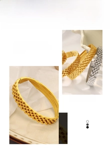 Macro detail of industrial style titanium steel gold-plated bracelet with grid texture
