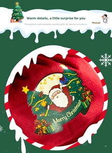 Detail of red velvet Christmas apple bag featuring colorful Santa and tree print