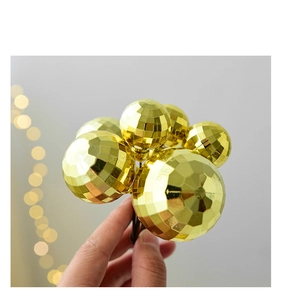 Detail of faceted golden decorative balls for cake toppers and party decoration