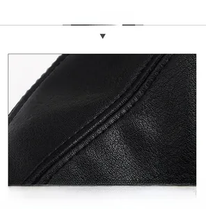 Detail of premium stitching on the crown of a black faux leather duckbill cap for men