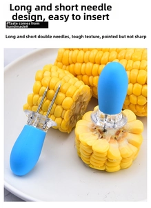 Detail of stainless steel corn holder with blue ergonomic handle and dual-prong design