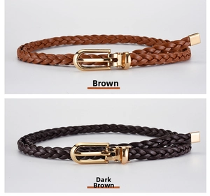 Detail of woven leather skinny belts in brown and coffee with gold metal buckles