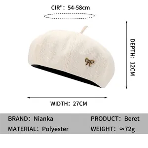 Cream white solid beret hat for women with vintage copper bow brooch and sizing details