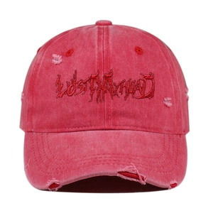 Detail of red distressed baseball cap featuring LOST MY MIND embroidery and frayed edges
