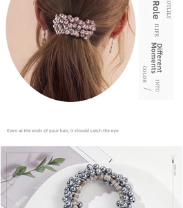 Detail of beaded faux pearl hair scrunchies in pink and grey colors for ponytails