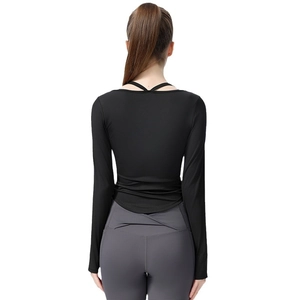 Slim fit black long sleeve yoga top with cross strap back design for women