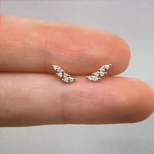 Macro shot of S925 silver marquise-cut diamond crawler earrings in gold plating