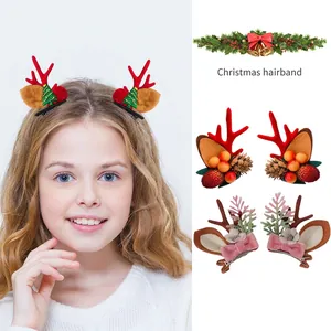 Christmas hair clip set featuring reindeer antlers, pine cones and festive bow elements