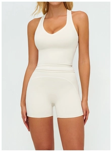 Close-up of high-waisted beige yoga shorts with professional stitching and matte fabric
