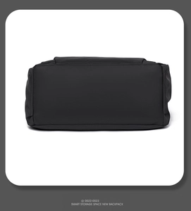 Detailed bottom view of a waterproof black shoulder bag showing smart storage capacity