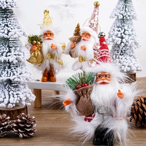 Three plush 5-inch Santa Claus dolls with festive accessories for Christmas party decor