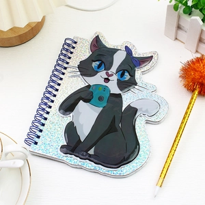 Detail of laser glitter notebook cover featuring a cartoon black cat and blue coil binding