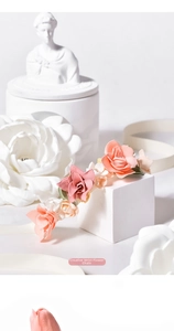 Close-up of handmade rose wrist corsage with silk ribbon and pearl accents