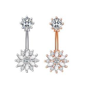 Detail of silver and rose gold snowflake navel rings with sparkling white zircon stones