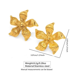 Detail view of gold flower earrings with size measurements and product dimensions