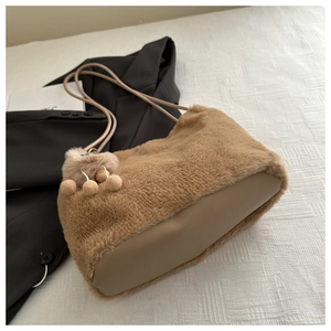 Detailed close-up of plush faux rabbit fur texture and PU leather base on a tote bag