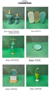 Deep green velvet jewelry display bust and stands with gold trim for necklace storage