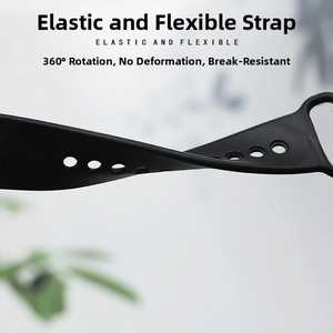 Macro view of a flexible black silicone sports watch band showing 360-degree rotation