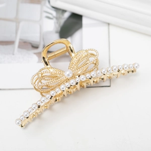 Elegant gold metal hair claw clip with pearl bow design and large round pearls