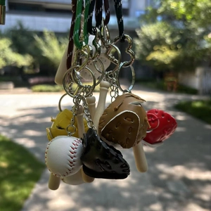 Miniature baseball keychain set with leather gloves, wooden bat and sports ball details