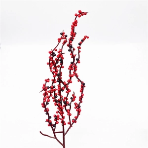 Close-up of artificial Christmas red and black berry stems for DIY wreath decoration