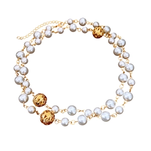 Double-layered gray pearl necklace with gold hollowed metal beads on a clean background