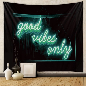 Detail showing the fabric texture and 'good vibes only' neon typography on black tapestry