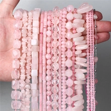 Macro shot of assorted faceted pink crystal beads in various shapes for jewelry making
